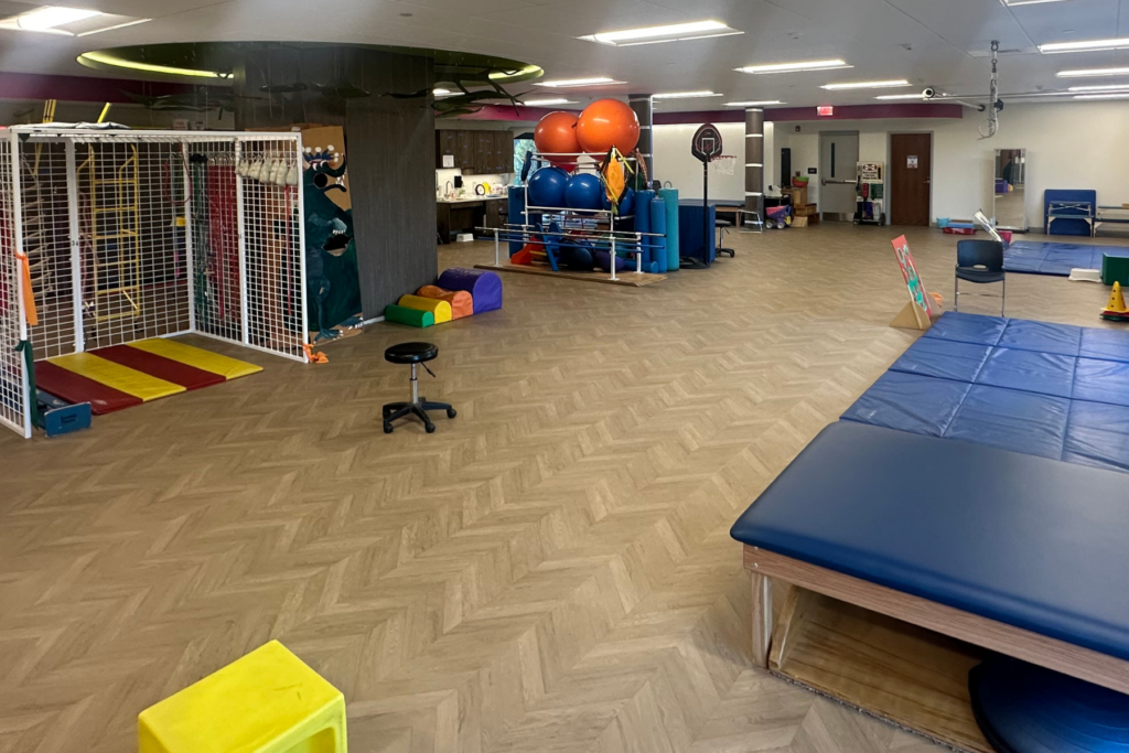 Overview of the physical therapy gym full of equipment.