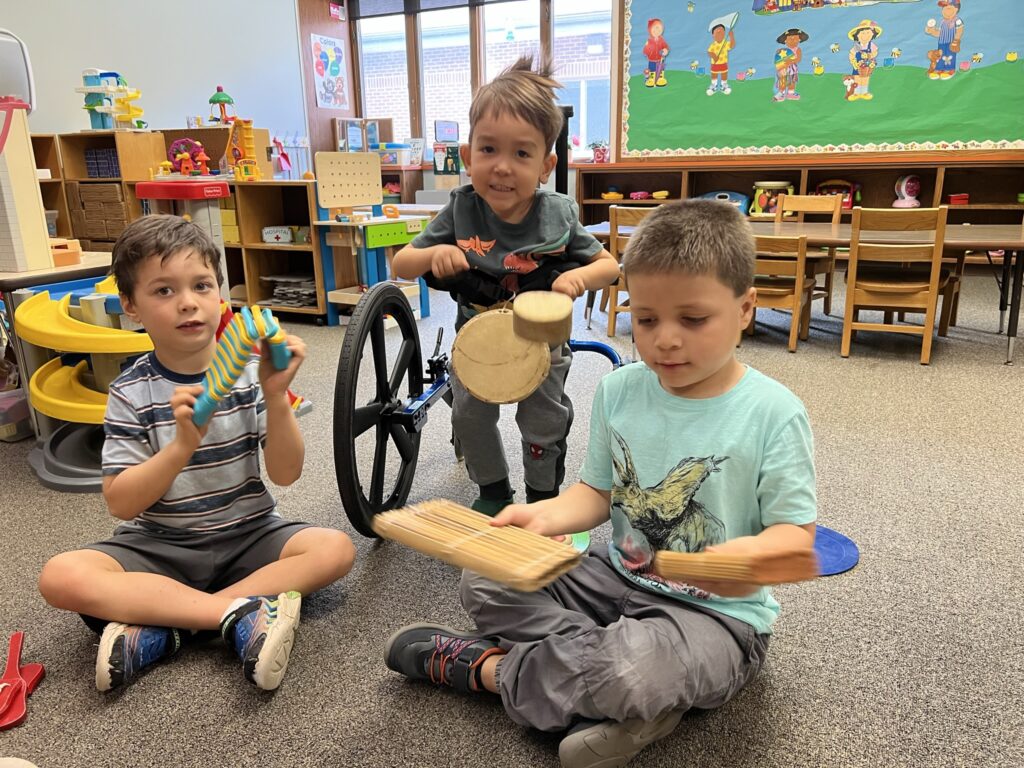 Boys playing in the classroom with toys