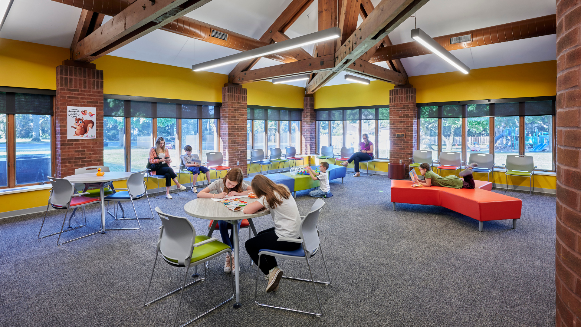 A view of the interior of Schreiber Pediatrics Center with children working and playing at tables.