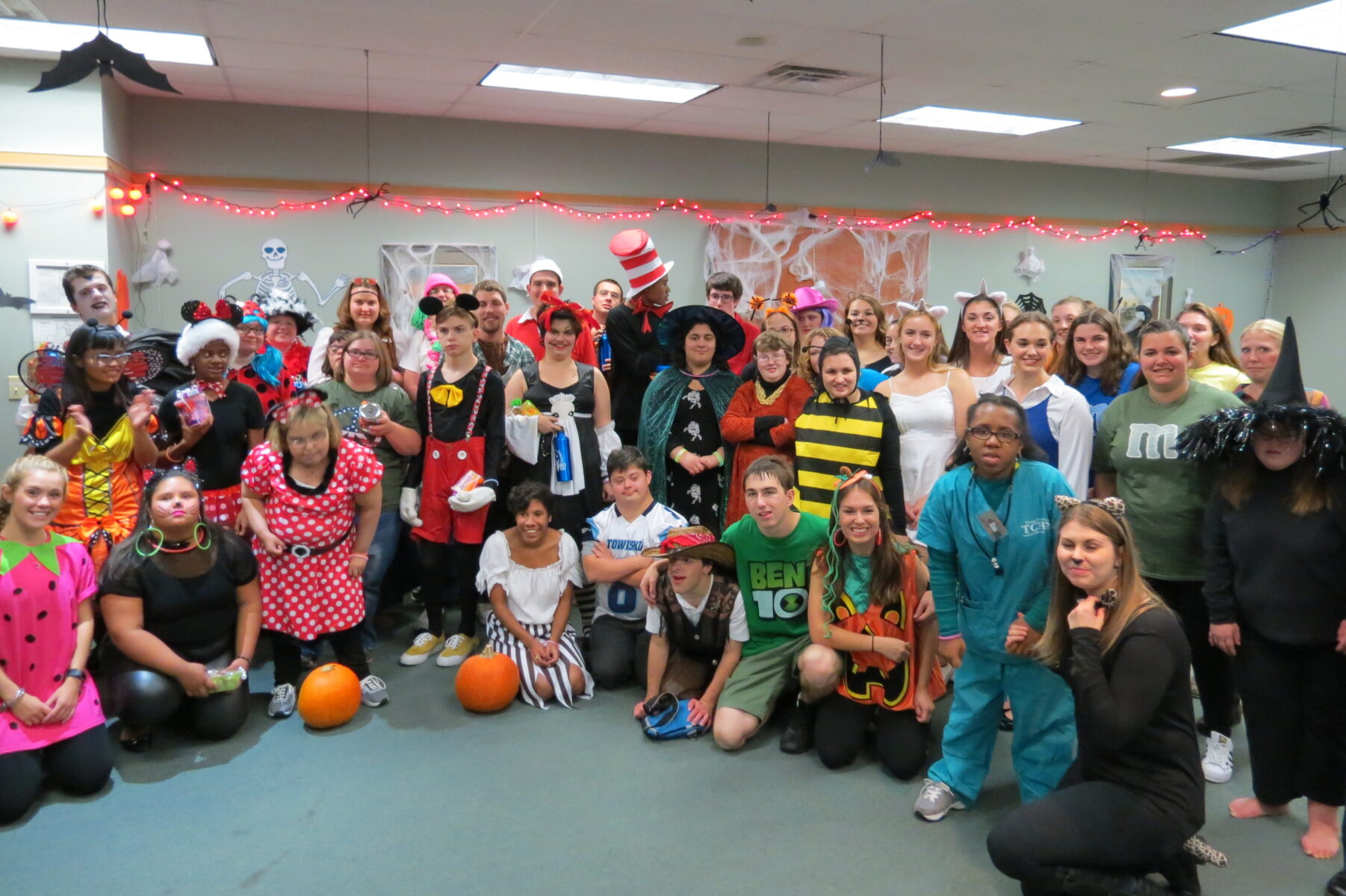 group picture of kids in costumes in classroom