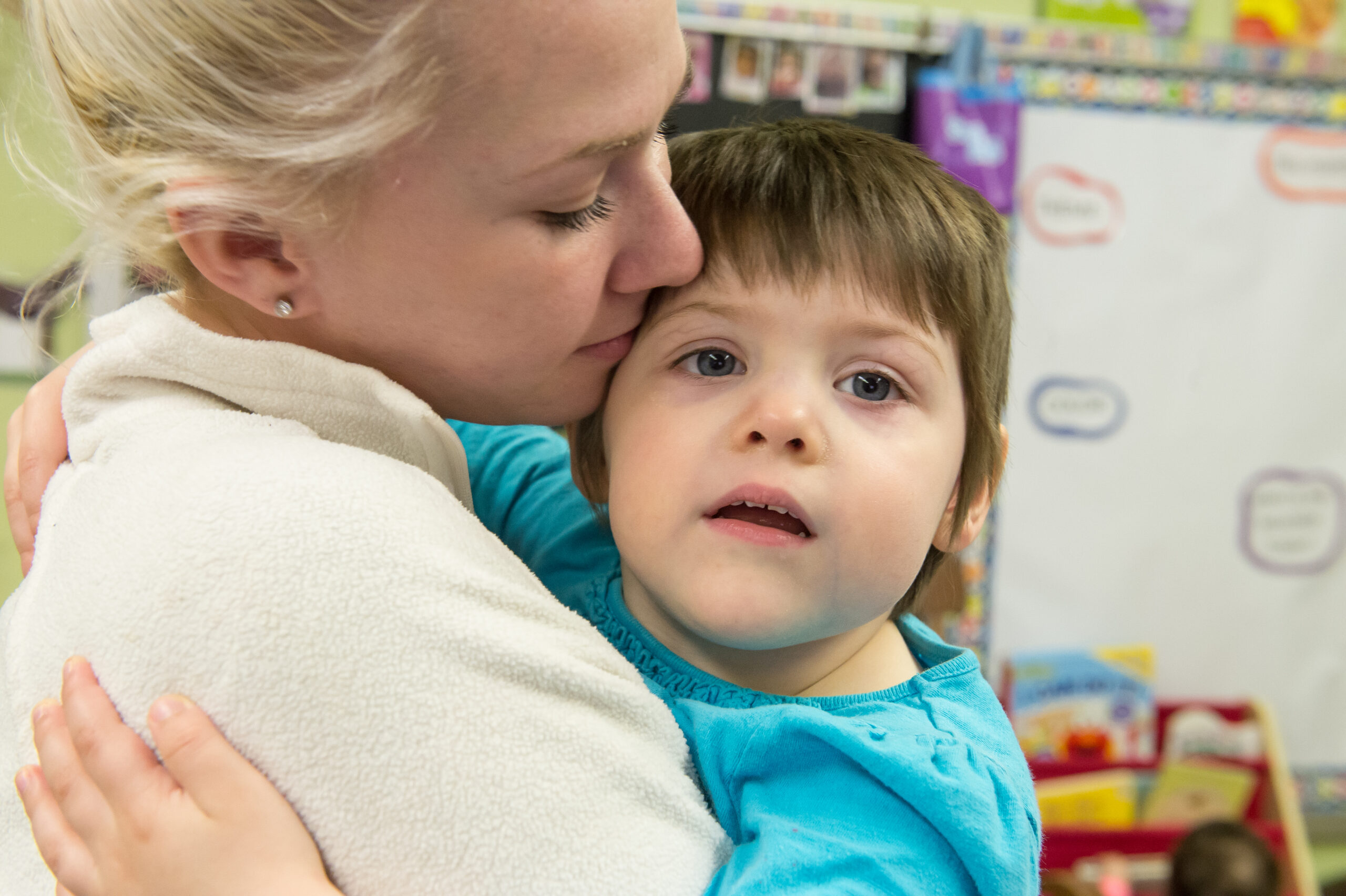 woman hugging a student